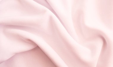 Kırışık kumaş dokusu. Pembe dalgalı kumaş arkaplan