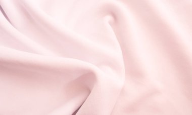 Kırışık kumaş dokusu. Pembe dalgalı kumaş arkaplan