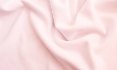 Kırışık kumaş dokusu. Pembe dalgalı kumaş arkaplan