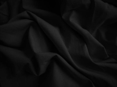 Siyah buruşuk kumaş dokusu. Koyu renk arka plan