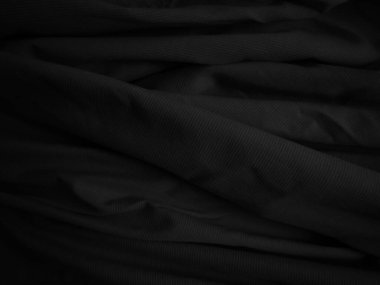 Siyah buruşuk kumaş dokusu. Koyu renk arka plan