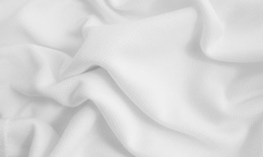 Beyaz buruşuk kumaş arka plan. Dalgalı kumaş dokusu