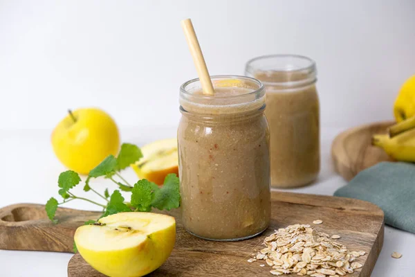 Banana-apple smoothie with oatmeal and honey. High quality photo