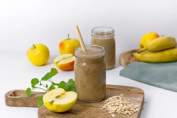Banana-apple smoothie with oatmeal and honey. High quality photo