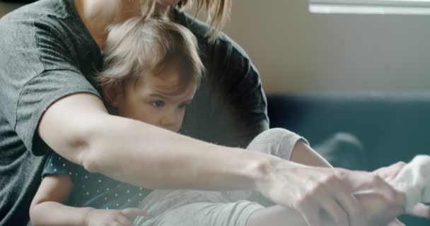 Mother Putting Socks Baby Girl Shot Raw Cinema Camera — Stock Video
