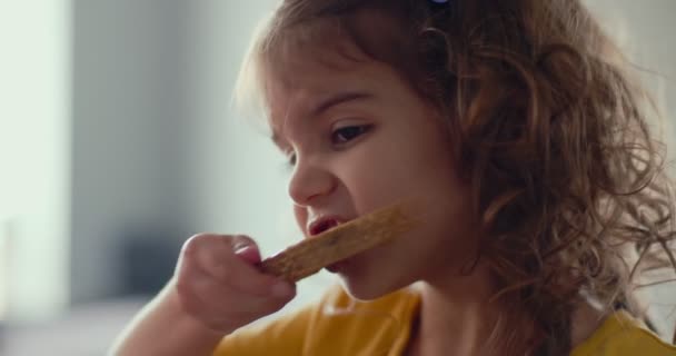 Toddler Girl Eating Peanut Butter Sandwich Snack Home Shot Cinema — Stock Video