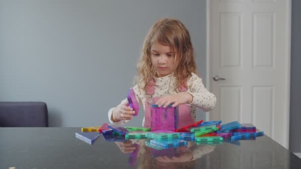 Toddler Girl Building Tower Magnetic Tiles Home Learning Stem Concept — Stock Video