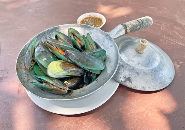 Steamed mussels with sweet basil leaves, Thai style seafood. Selective focus