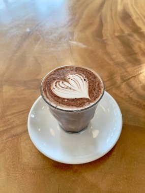 Hot chocolate with heart shaped latte art, selective focus