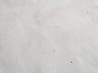 Weathered white cement wall background and texture for modern or retro and vintage interior design