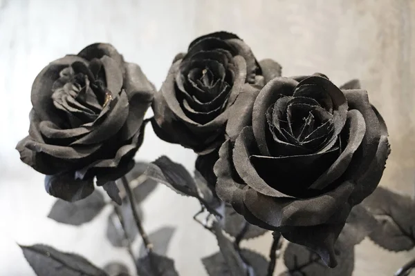 Black roses. Black artificial roses flower, selective focus