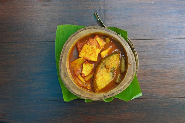 stock image Southern Thai Spicy Sour Yellow Curry with young coconut shoots and Sea Bass, famous Thai food. Top view , Selective focus