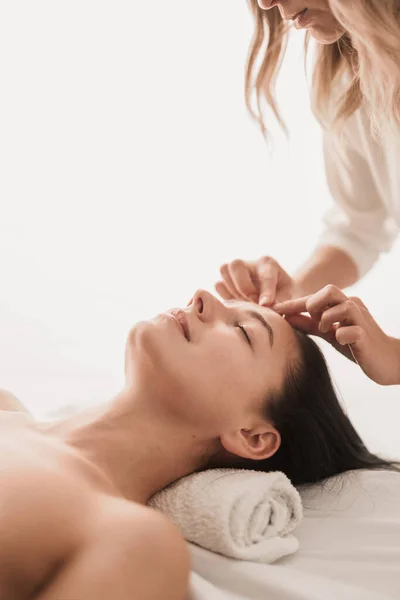 Side View Crop Unrecognizable Female Lying Bed Massaging Face Skin — Foto Stock