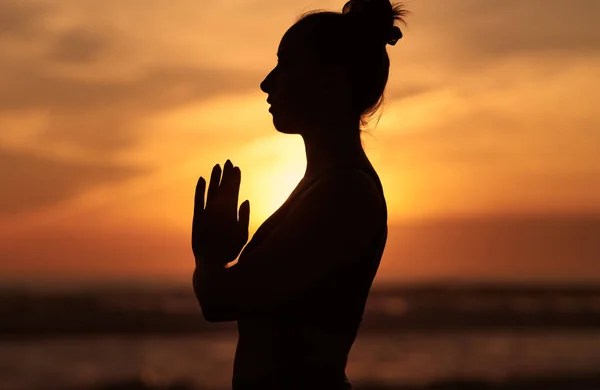 Side View Silhouette Young Female Holding Hands Namaste Pose Praying — Stock Photo, Image
