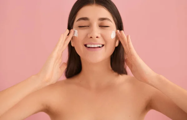 Cheerful Young Female Bare Shoulders Applying Moisturizing Cream Face Eyes — Stock Photo, Image