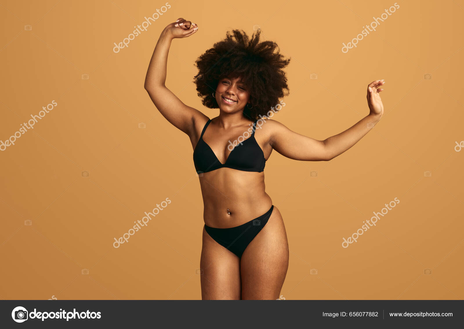 Smiling African Female Black Underwear Raising Arms While Jumping Dancing  Stock Photo by ©kegfire 656077882