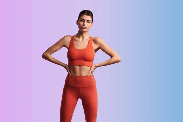 Young Confident Hispanic Female Athlete Red Tight Activewear Standing Hands — Stock Photo, Image