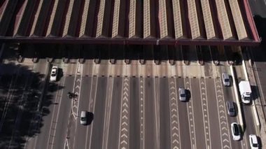 Aerial view of traffic jam before tolls on highway, urban city in Portugal. Multiple cars passing through paid road check point.