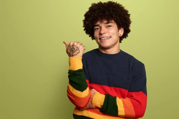 Happy Young Hispanic Male Ccolor Striped Sweater Smiling Showing Thumb — Fotografia de Stock