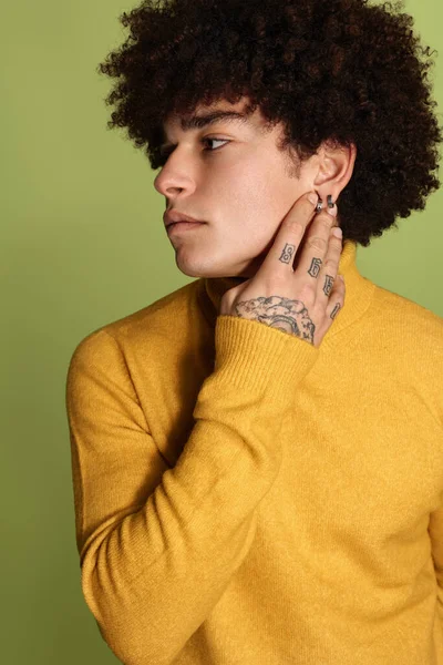 Pensive Male Model Yellow Turtleneck Afro Hairstyle Touching Neck Green — Stockfoto