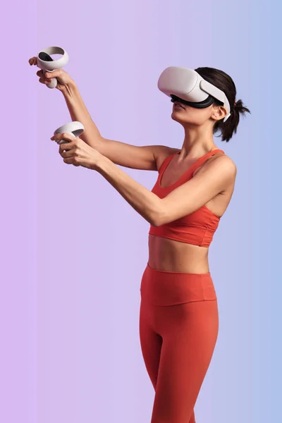 Young Slim Sportswoman Red Activewear Headset Raising Hands Controllers While — Stock Photo, Image