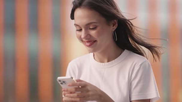 Closeup Young Woman Casual Clothes Headphones Smiling Radiantly While Typing — Stock Video