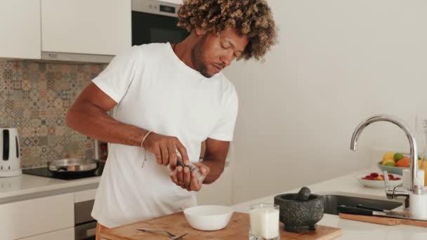 Curly African Male Prepares Breakfast Grinding Pepper Home Kitchen Morning — Stock Video