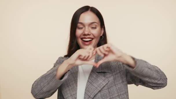 Cheerful Young Woman Making Heart Shape Her Hands Symbolizing Love — Stock Video