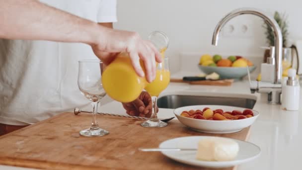Close Couples Hands Pouring Vibrant Orange Juice Glasses Healthy Refreshing — Stock Video