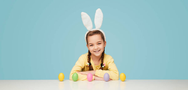 Happy Little Girl Wearing White Bunny Ears While Posing White Stock Photo