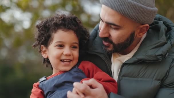Heartwarming Moment Bearded Man Cuddles His Smiling Young Son Outdoor — Stock Video