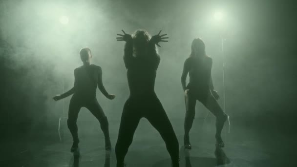 Three Dancers Perform Warm Routine Stage High Heels Silhouetted Dramatic — Stock Video