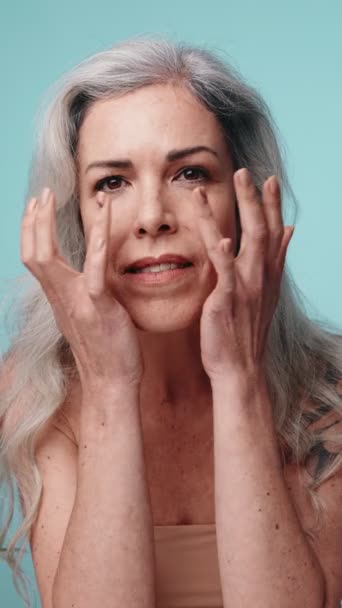 Elegant Senior Woman Posing Hands Gracefully Placed Her Face Teal — Stock Video