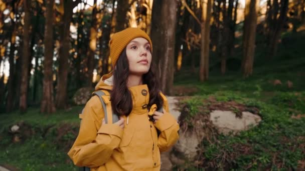 Contemplative Woman Hiking Forest Yellow Hat Jacket Stand Out Greenery — Stock Video