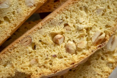 Biscotti with a close-up of peanuts. Barely as a background - biscotti. Fresh biscotti lies on a slide.
