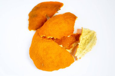 The skin of the tangerine is dried. Dry ingredients for tea and compote - tangerine skin. Lots of dried citrus skin.