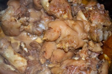 Stewed pork legs. A dish of pork legs. Appetizer of stewed pork legs in sauce.