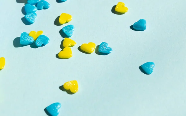 yellow and blue hearts on a blue background. Decoration for Easter in the form of hearts. St. Vadlentin\'s Day in Ukraine is a yellow-blue heart.