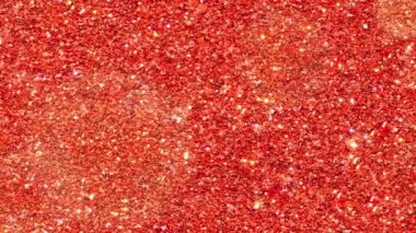 Bokeh röfleli kırmızı parıltı. Gösterişli soyut şenlik arka planı. Yuvarlak parçacıkların dekoratif arka planına sahip 4K stok videosu.