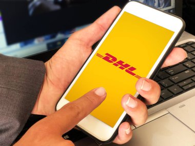Man using DHL Mobile application for delivering and transporting goods, modern editorail background