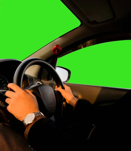 Person Driving a car with green screen on wind screen and door window backdrop. Car Driving holding stearing wheel background with screen replacement concept