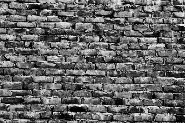Black and White old texture bricks wall backdrop with mud and blocks. Bricks texture wallpaper