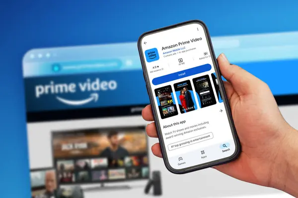 Stock image 9.8.2024, Pakistan. Streaming platform Amazon Prime application on Mobile Screen and web version in the backdrop, entertainment editorial.