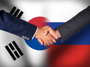 Güney Kore ve Rusya arasındaki anlaşma veya dostluk arkaplanda bayrak ile temsil ediliyor.