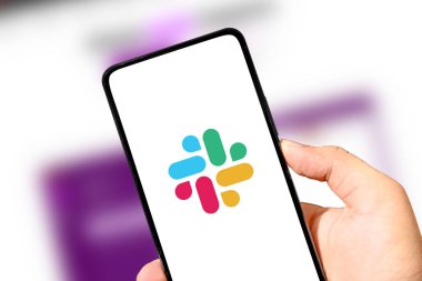 Slack Team communication mobile application on the smartphone screen close up, illustrative editorial background clipart