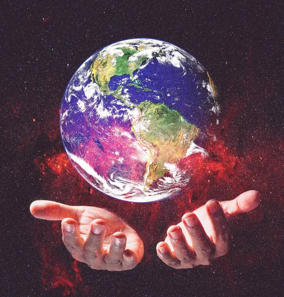 Earth and environment in hands on black background. Love the earth concept, protect the environment, earth day