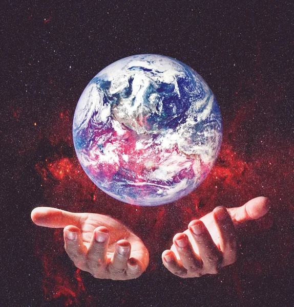 Earth and environment in hands on black background. Love the earth concept, protect the environment, earth day