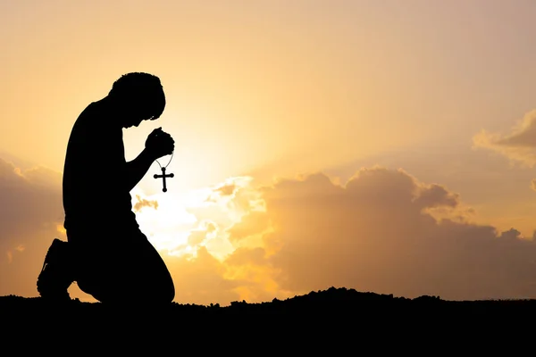 man praying for blessings from god. A lonely, heartbroken, unemployed and hopeless man