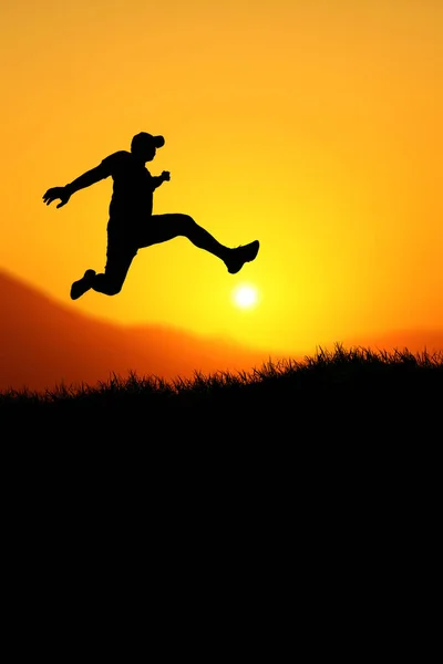 Vertical silhouette of a man jumping to the future. The concept of moving on to something better