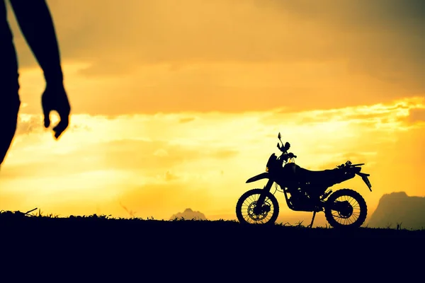 Motocross bike with mountain view in beautiful sunset lights. motorcycle travel concept